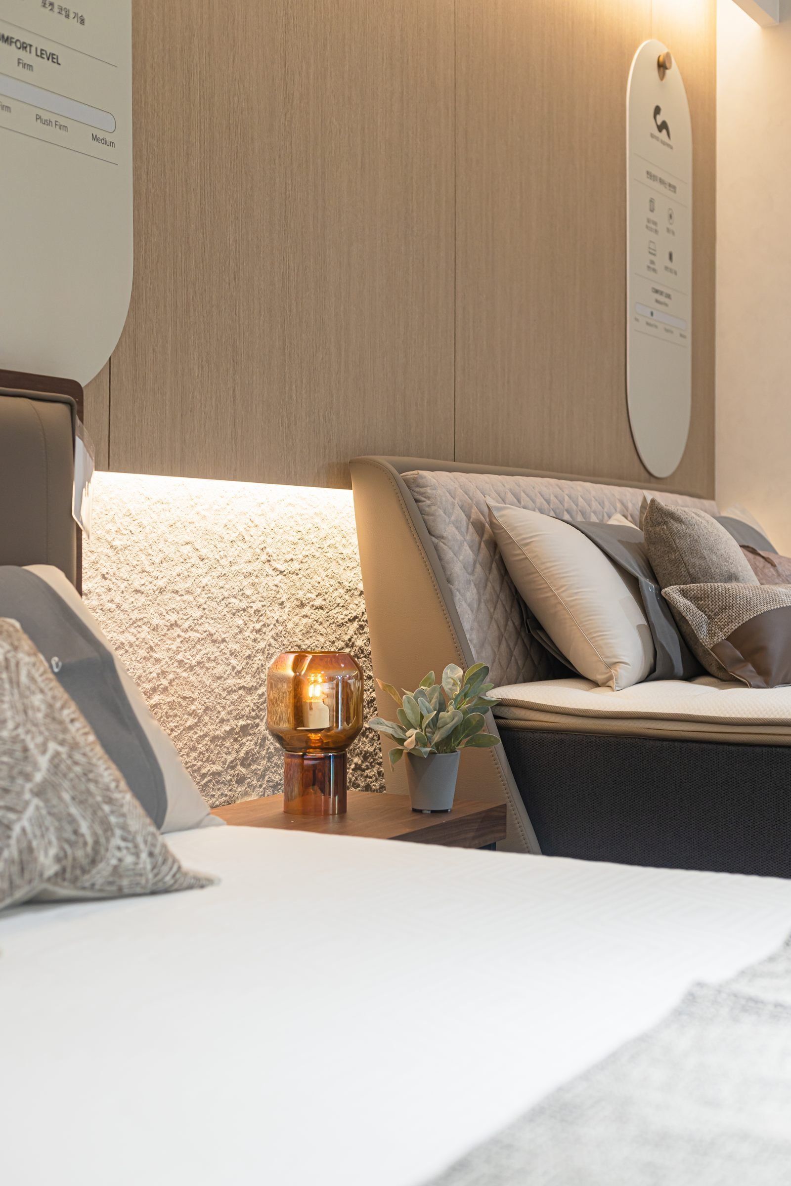 Bedroom display with timber headboard and cove lighting
