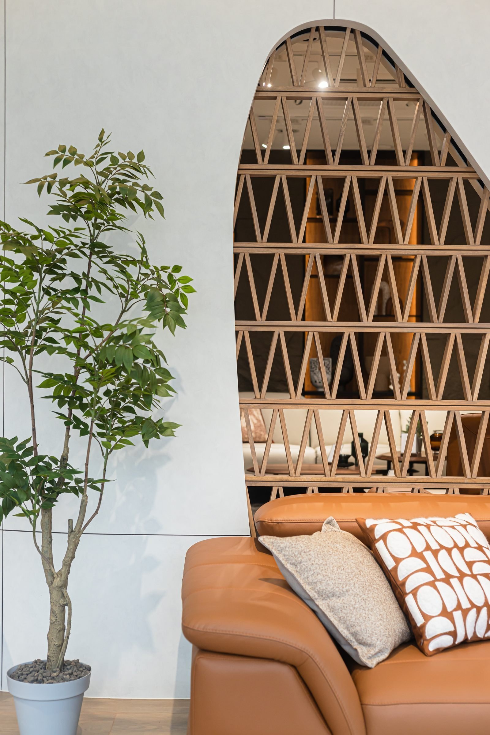 Portrait view of the timber screen and leather lounge chair